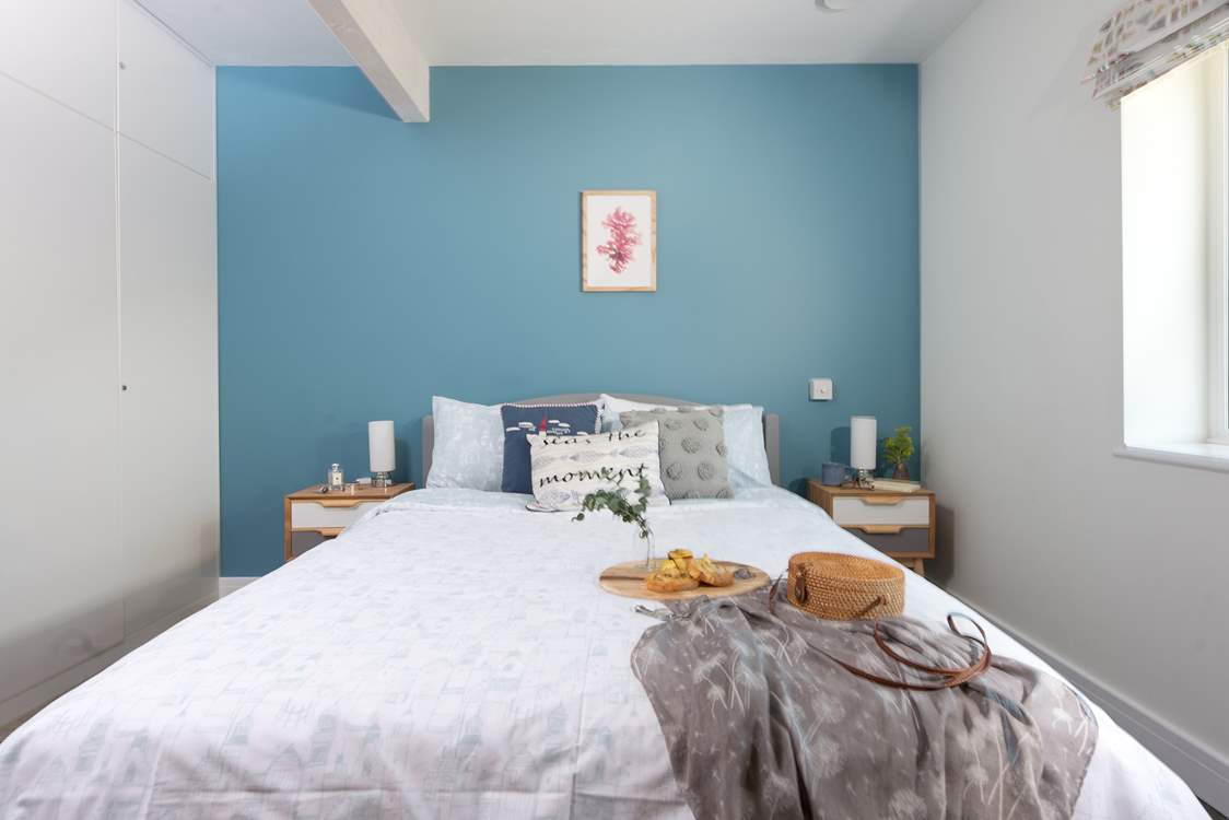 A king-size bed awaits in bedroom one located off the half-landing.