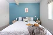 A king-size bed awaits in bedroom one located off the half-landing.