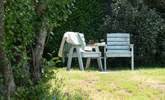 The garden offers a choice of places to sit out and relax. - Thumbnail Image