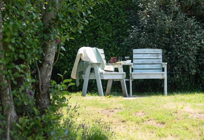 The garden offers a choice of places to sit out and relax.