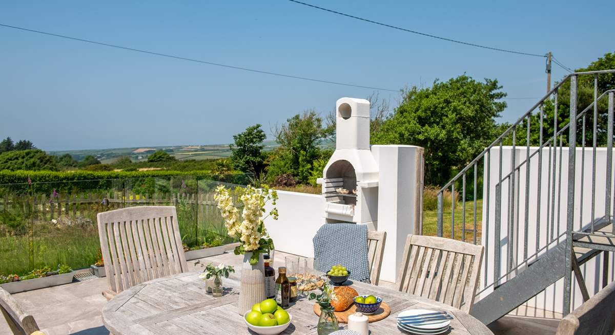 Steps from the sitting-room, lead you down to the sunny terrace