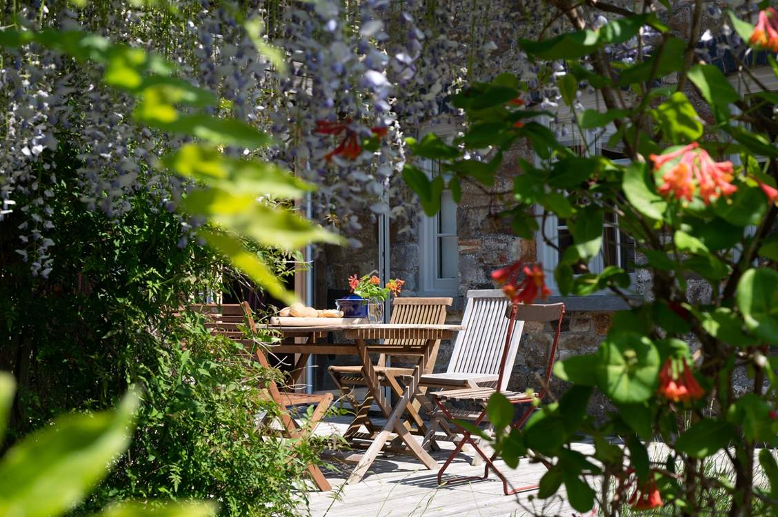 Perfect shady corner on a summer's day with the fragrance of wisteria in the air.