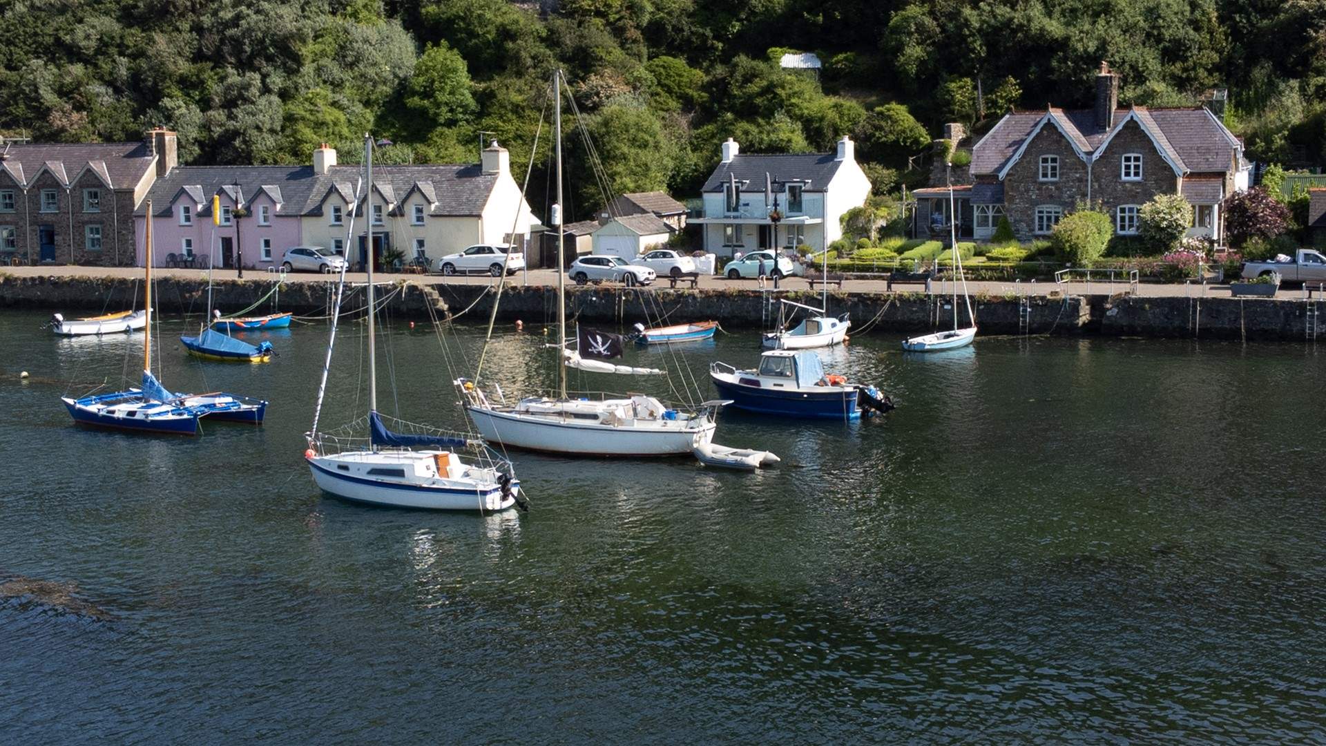 Watch the ebb and flow of the tide and the mellow comings and goings on the quay.