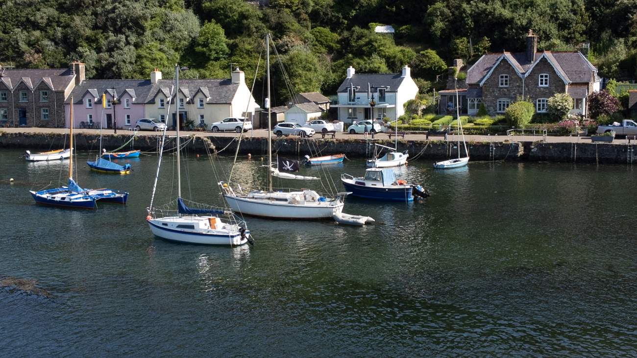 Watch the ebb and flow of the tide and the mellow comings and goings on the quay.