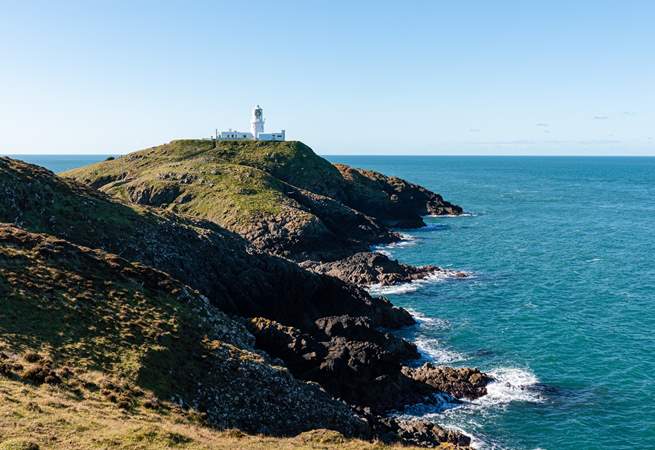 Strumble Head Lighthouse sitting on the dramatic Pembrokeshire coastline. 