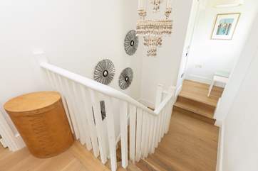 The turning staircase leads from the ground floor, with two steps into the bathroom and two bedrooms up a further flight.