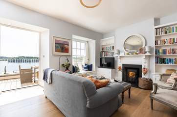 The open plan living space is on the ground floor with a stunning terrace. (Please note the wood-burning stove is not for use).