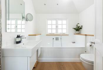 The lovely family bathroom has a bath and separate shower cubicle.