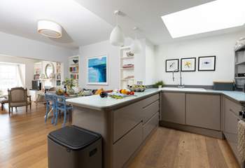 The swish kitchen is light and bright. 