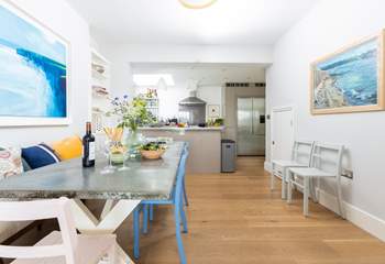 The dining-table sits in between the kitchen and sitting area, perfect for sociable dining. 