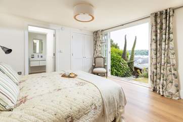 The beautiful lower ground floor bedroom is accessed via external steps through the garden and has a king-size double bed and en suite shower-room.