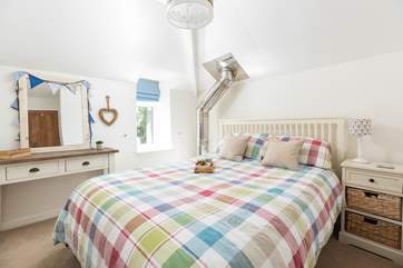 Cosy and comfy bedroom two, with its own 'art installation' but don't worry the double insulated flue never gets hot.