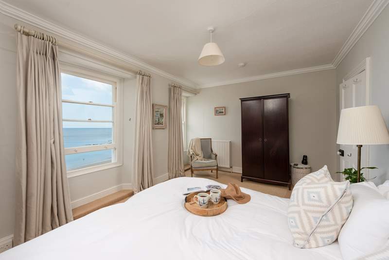 Sea views from both sides of the bed.
