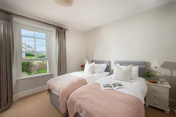 Soft pinks and greys in pretty bedroom two.