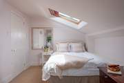 Bedroom three features a double bed. Please mind your head on the sloping ceiling.