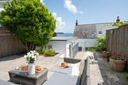 The raised terrace to the rear of the house, another great spot to spend time.