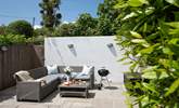 The rear terrace is a lovely sheltered spot to sit and relax. - Thumbnail Image