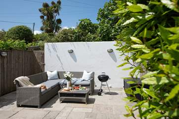 The rear terrace is a lovely sheltered spot to sit and relax.
