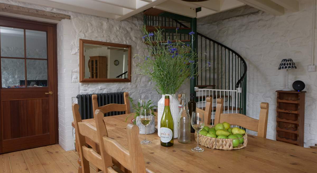 The large farmhouse dining-table lies at the other end of this room and is the perfect spot for long leisurely lunches and more formal dinners.