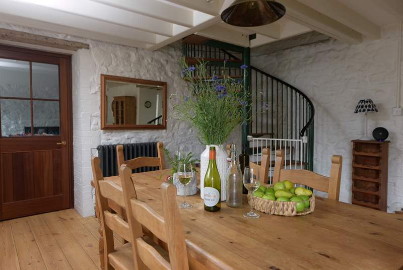 The large farmhouse dining-table lies at the other end of this room and is the perfect spot for long leisurely lunches and more formal dinners.