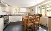 Step into the inviting kitchen which overlooks the garden and is designed for sociable evening cooking and equipped to make the finest supper for your guests.  - Thumbnail Image