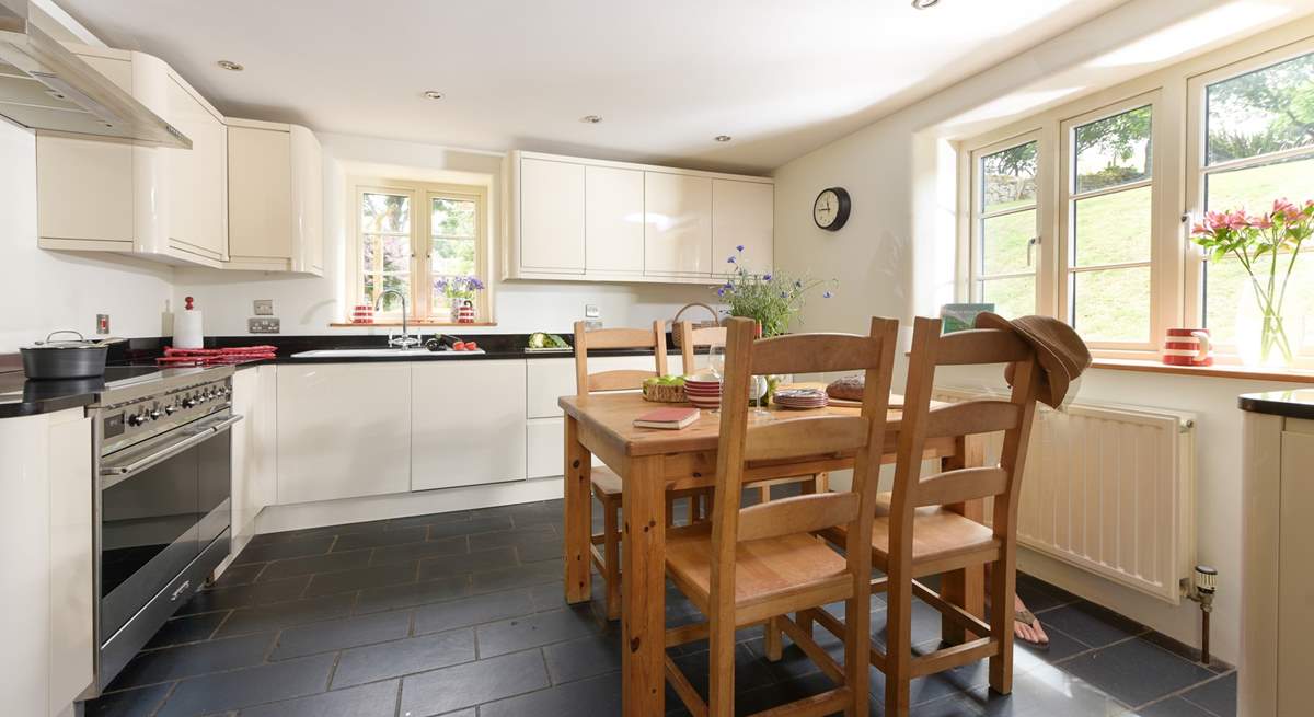 Step into the inviting kitchen which overlooks the garden and is designed for sociable evening cooking and equipped to make the finest supper for your guests. 