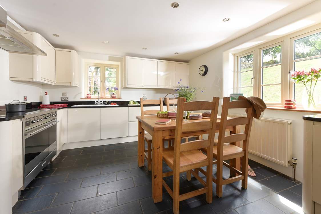 Step into the inviting kitchen which overlooks the garden and is designed for sociable evening cooking and equipped to make the finest supper for your guests.