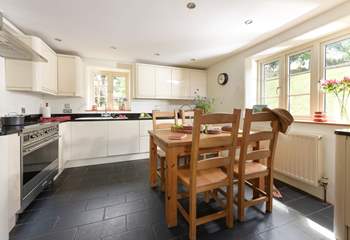 Step into the inviting kitchen which overlooks the garden and is designed for sociable evening cooking and equipped to make the finest supper for your guests. 