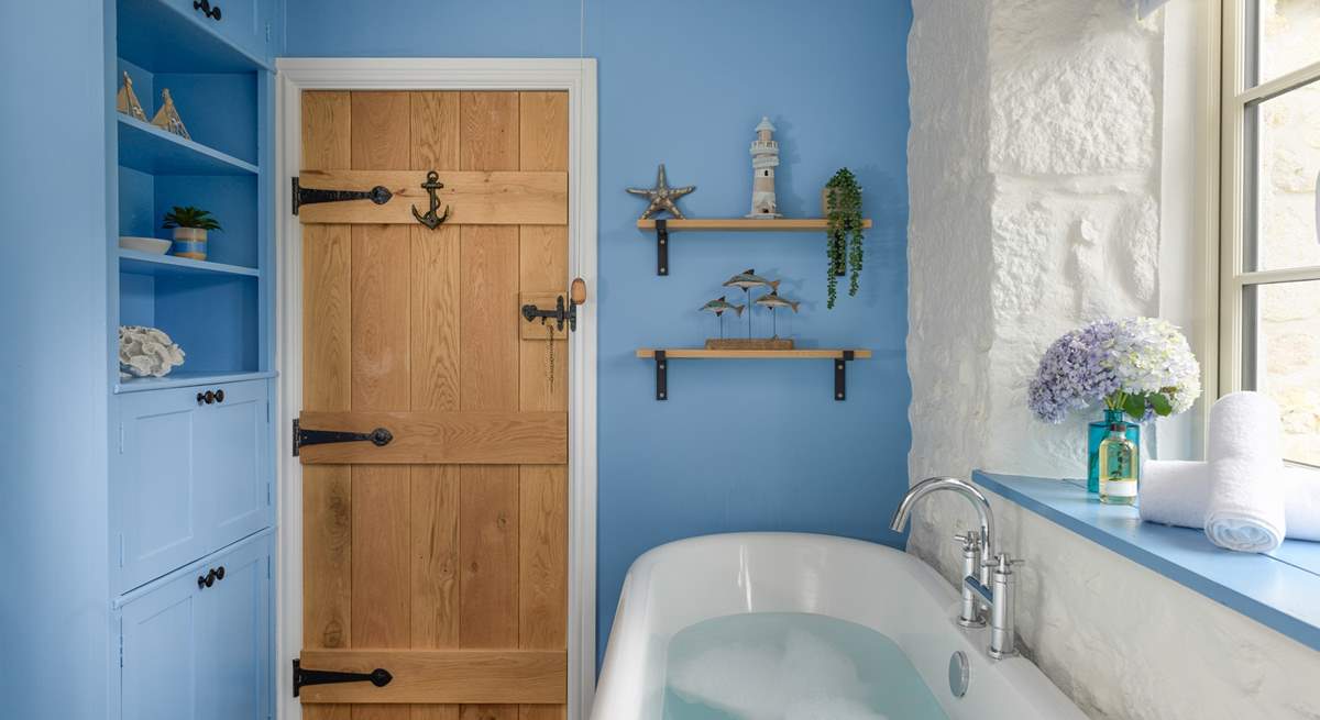 The rather lovely family bathroom has a free-standing bathtub. 