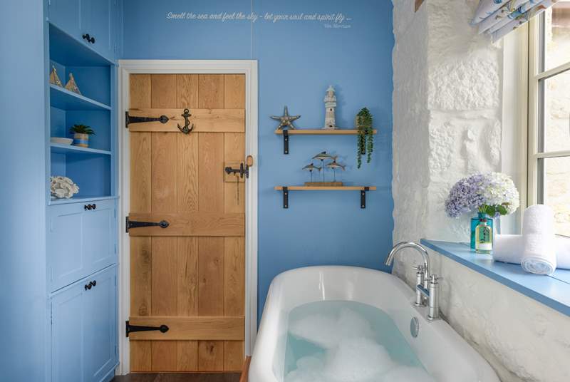 The rather lovely family bathroom has a free-standing bathtub. 