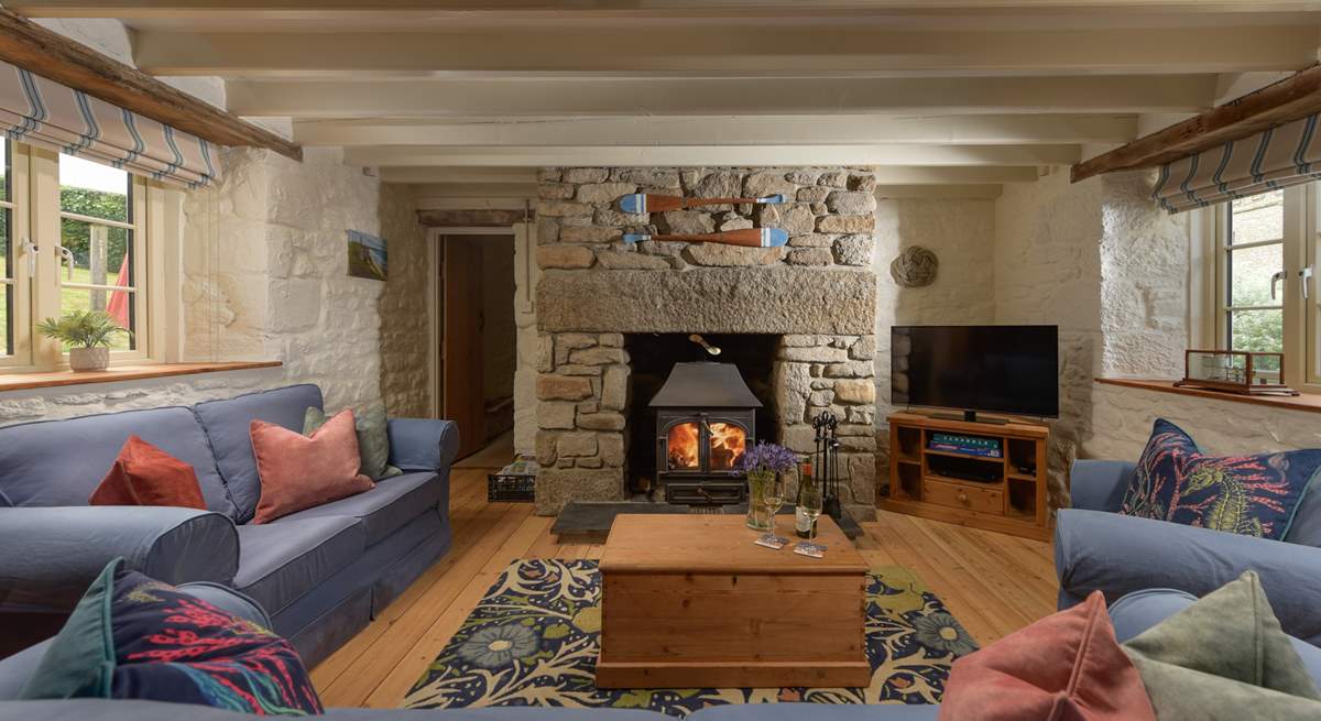 Relax around the flickering wood-burner, perfect for socialising and relaxing after busy day out exploring the coastal paths. 