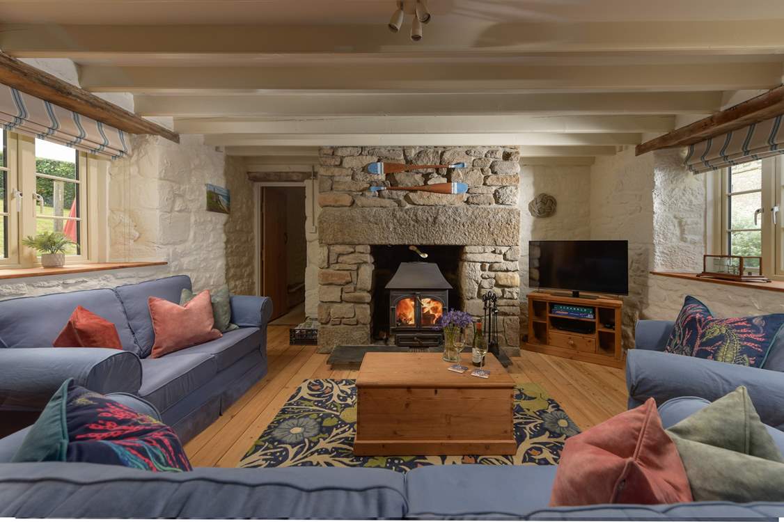Relax around the flickering wood-burner, perfect for socialising and relaxing after busy day out exploring the coastal paths.
