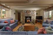 Relax around the flickering wood-burner, perfect for socialising and relaxing after busy day out exploring the coastal paths.