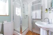 The main bedroom has a rather lovely en suite shower-room.