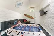 Perfect for our younger guests, this games-room is located off the living area.