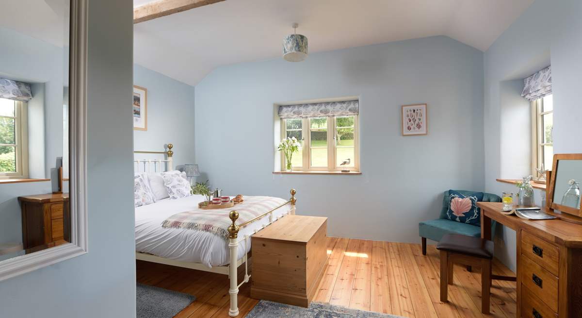 Bedroom 1 overlooks the gardens.