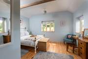 Bedroom 1 overlooks the gardens.