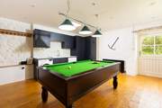 Smugglers Barn has two games areas, this one has a fantastic pool table located in the utility-room.