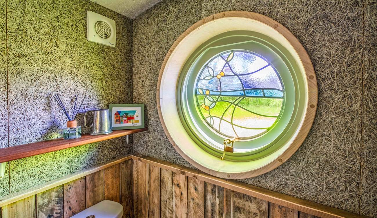 This beautiful stained glass window depicts the winding path through Powdermill Wood towards Battle. 