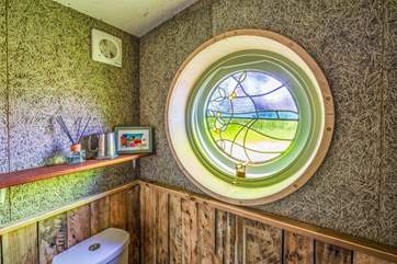 This beautiful stained glass window depicts the winding path through Powdermill Wood towards Battle.