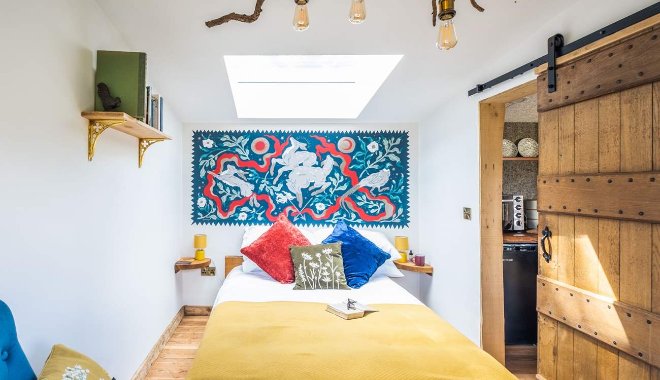 The bedroom is bright and airy.