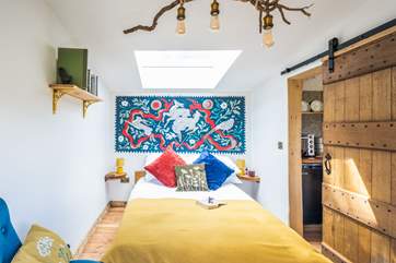 The bedroom is bright and airy.