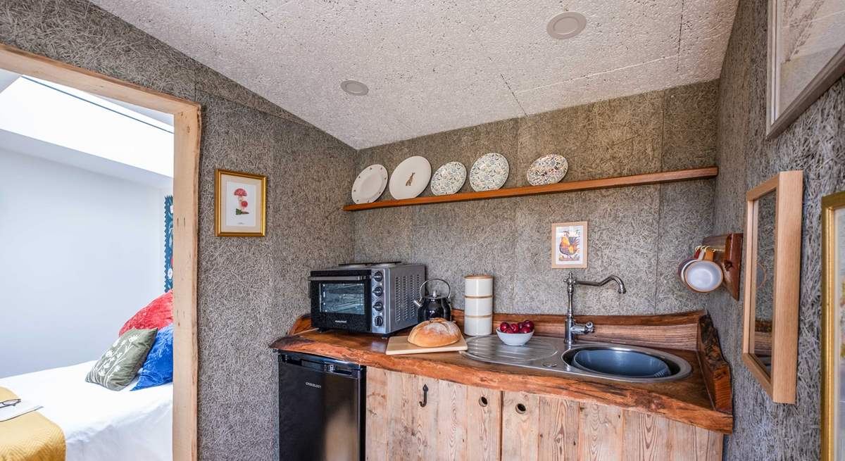 The rustic, wooden kitchen is well-equipped with all the essentials. 