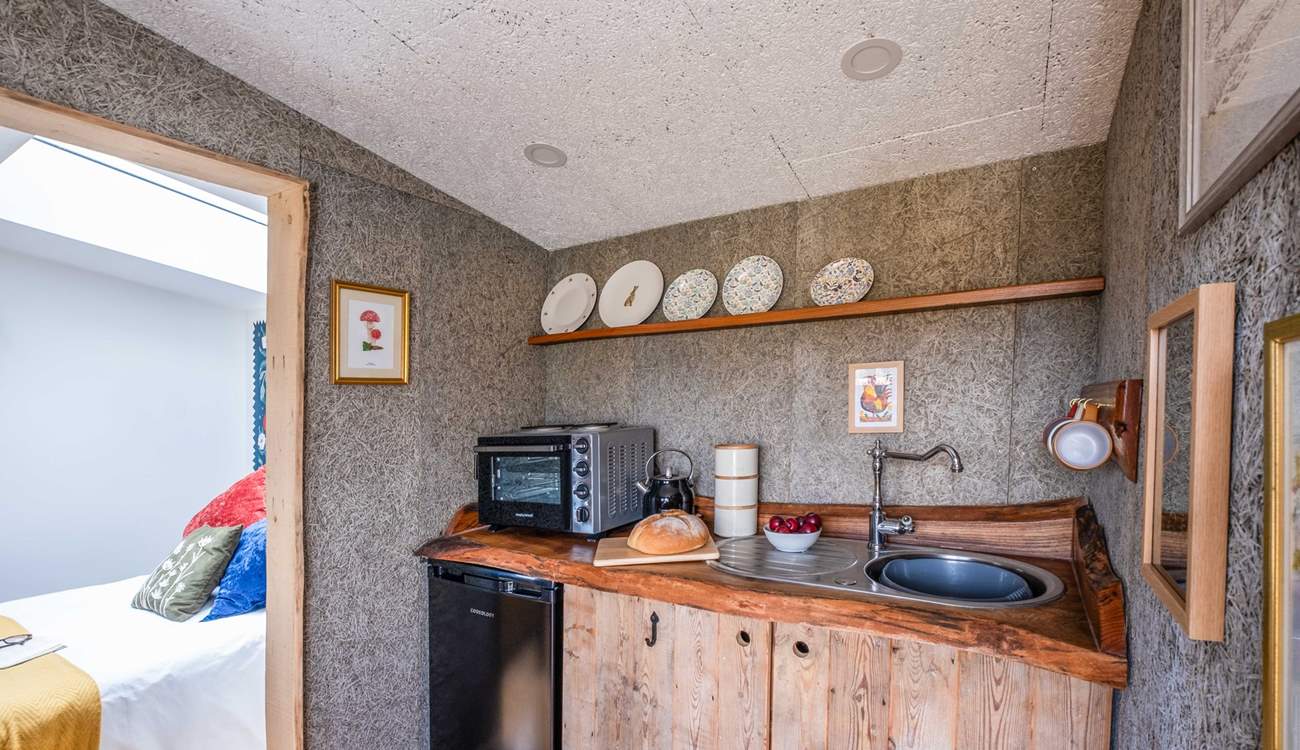 The rustic, wooden kitchen is well-equipped with all the essentials. 