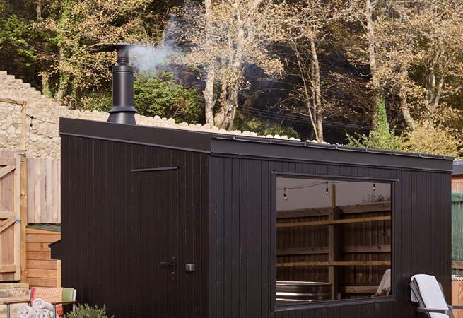 The traditional wood-fired sauna awaits for soothing R&R.