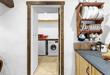A useful utility-room sits next to the kitchen.