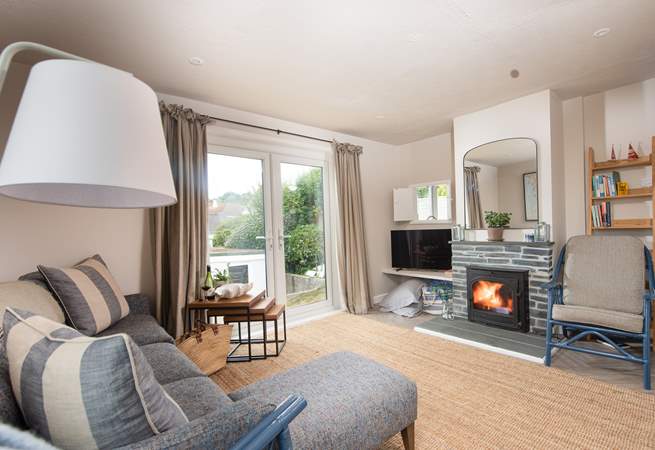 French doors from the sitting/dining-room lead out down some steps to the terrace.