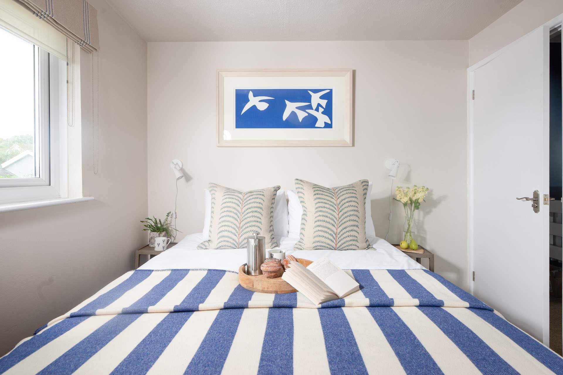 Bedroom one is beautifully styled.