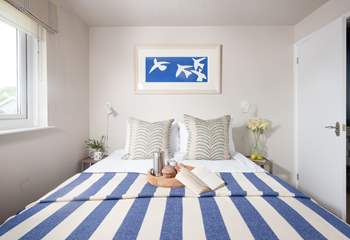 Bedroom one is beautifully styled.