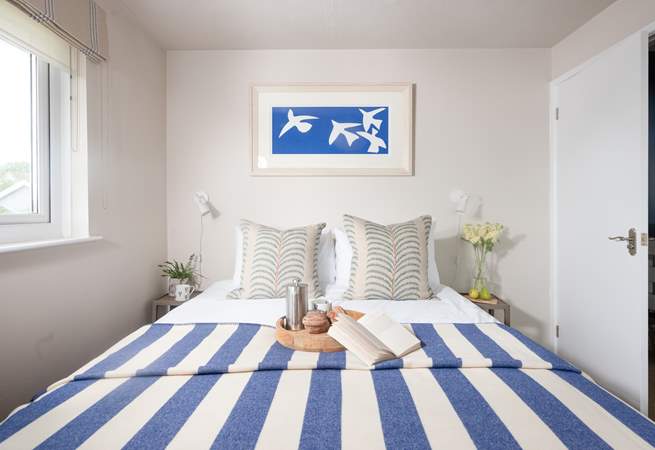 Bedroom one is beautifully styled.